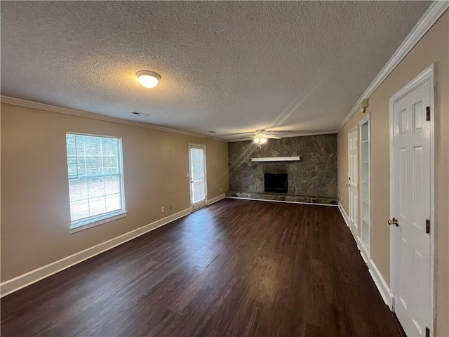 unfurnished living room with a fireplace, a textured ceiling, and crown molding