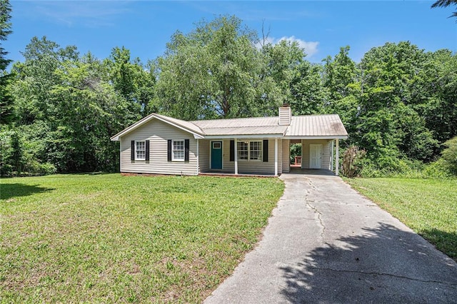 ranch-style home with driveway, a porch, and a front lawn