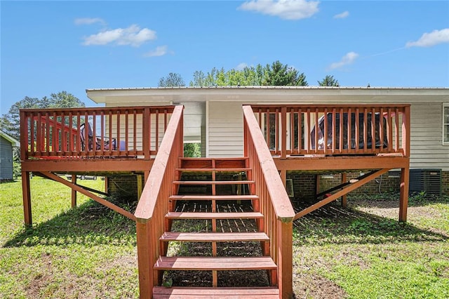 wooden deck with a yard, stairs, and central AC