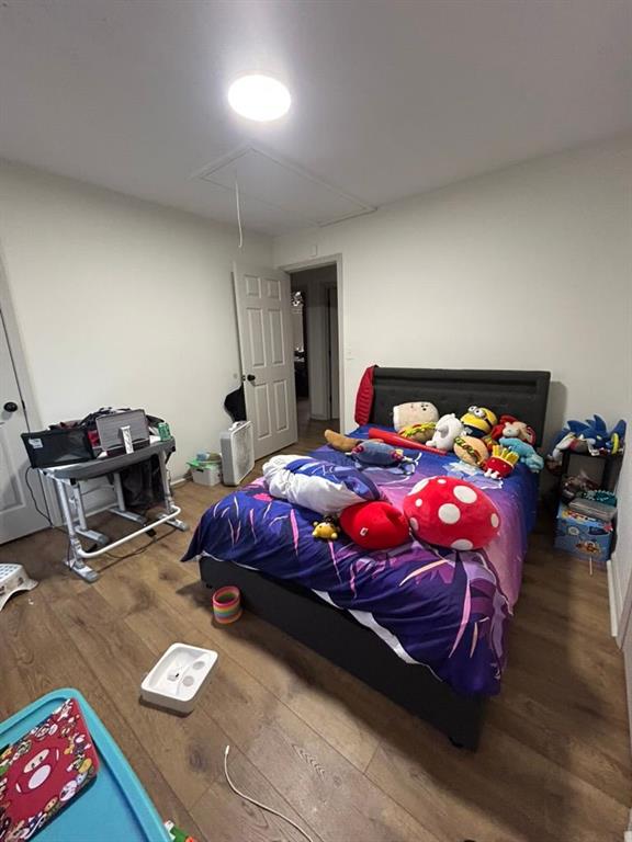 bedroom featuring hardwood / wood-style flooring