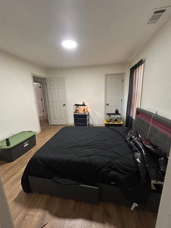 bedroom featuring hardwood / wood-style floors