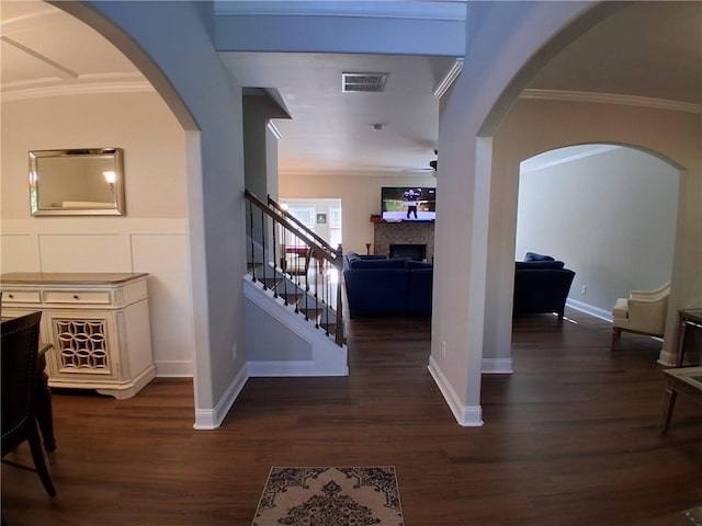 2647 Old Snapping Shoals Rd, Mcdonough, GA 30252 - entryway with wood finished floors, stairway, a fireplace, crown molding, and ceiling fan