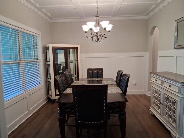 2647 Old Snapping Shoals Rd, Mcdonough, GA 30252 - dining area featuring a chandelier, arched walkways, a decorative wall, dark wood-style flooring, and ornamental molding