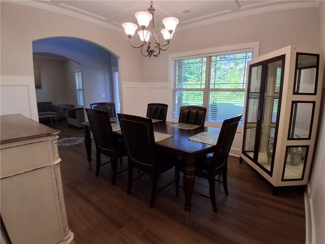 2647 Old Snapping Shoals Rd, Mcdonough, GA 30252 - dining area with a chandelier, dark wood-style floors, arched walkways, and crown molding