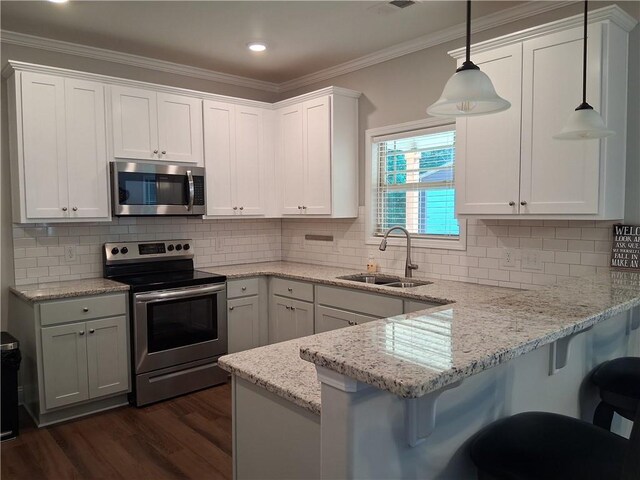 2647 Old Snapping Shoals Rd, Mcdonough, GA 30252 - kitchen with appliances with stainless steel finishes, a sink, dark wood-type flooring, a peninsula, and white cabinetry