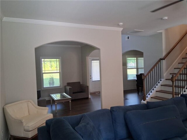 2647 Old Snapping Shoals Rd, Mcdonough, GA 30252 - living area featuring arched walkways, wood finished floors, crown molding, stairs, and baseboards