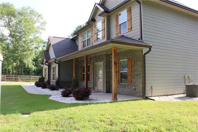 2647 Old Snapping Shoals Rd, Mcdonough, GA 30252 - view of side of home featuring central AC unit and brick siding