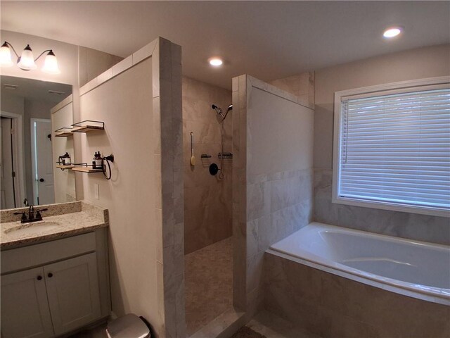 2647 Old Snapping Shoals Rd, Mcdonough, GA 30252 - bathroom featuring a garden tub, a walk in shower, vanity, and recessed lighting