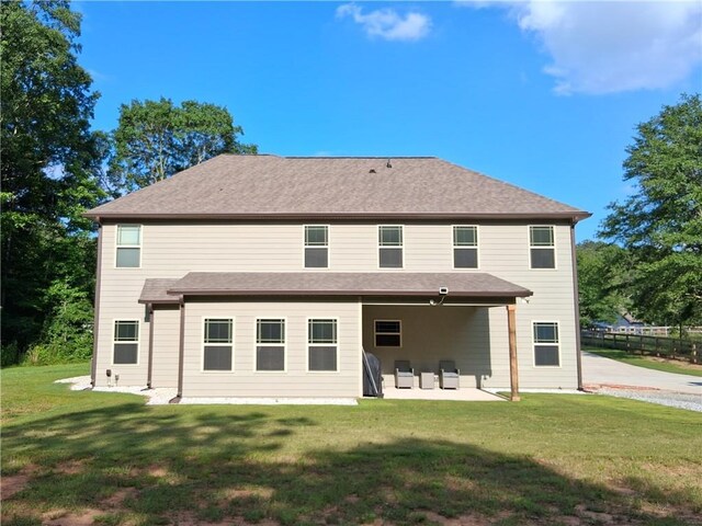 2647 Old Snapping Shoals Rd, Mcdonough, GA 30252 - back of property featuring a patio and a lawn