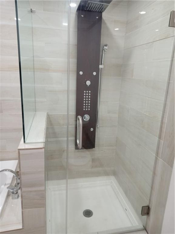 full bathroom featuring a stall shower