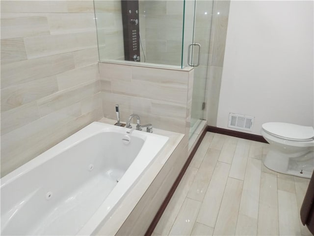 full bath featuring a stall shower, visible vents, baseboards, toilet, and a tub with jets