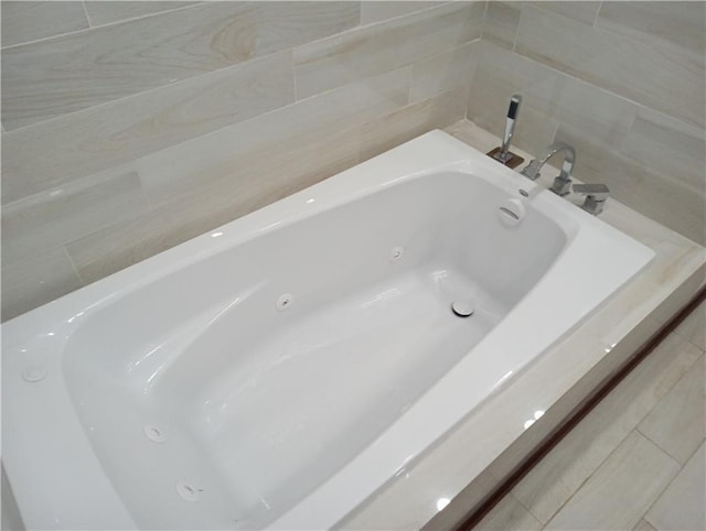 bathroom with a jetted tub