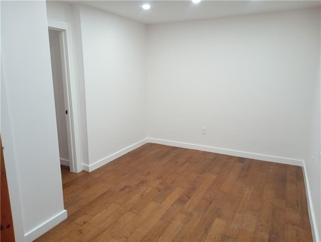 unfurnished room featuring baseboards, recessed lighting, and light wood-style floors