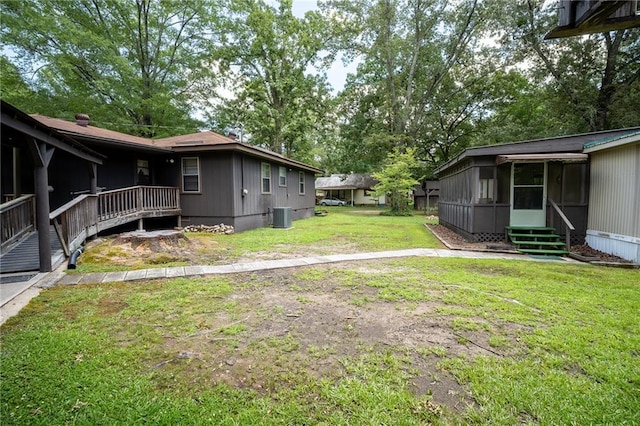 67 Dixie Park Rd, Rome, GA 30165 - view of grassy yard with entry steps and a sunroom