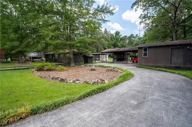 67 Dixie Park Rd, Rome, GA 30165 - rear view of house featuring a carport, driveway, and a yard
