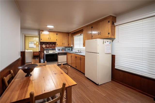 67 Dixie Park Rd, Rome, GA 30165 - kitchen with white appliances, washer / clothes dryer, light wood-style flooring, wainscoting, and wooden walls