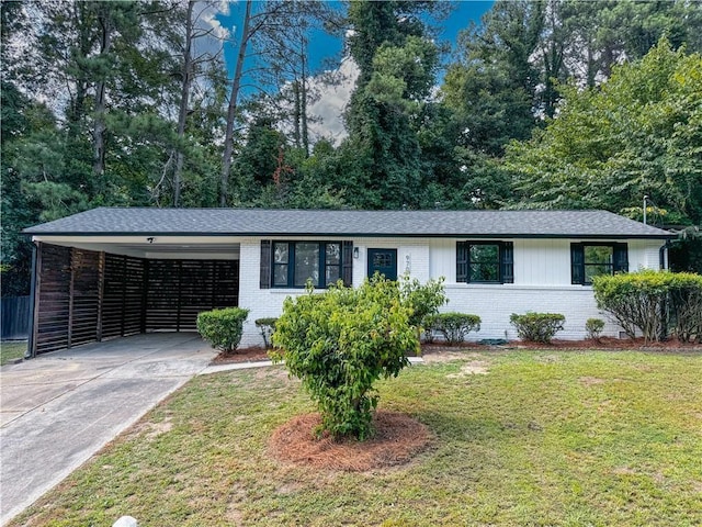 ranch-style house featuring a carport and a front yard