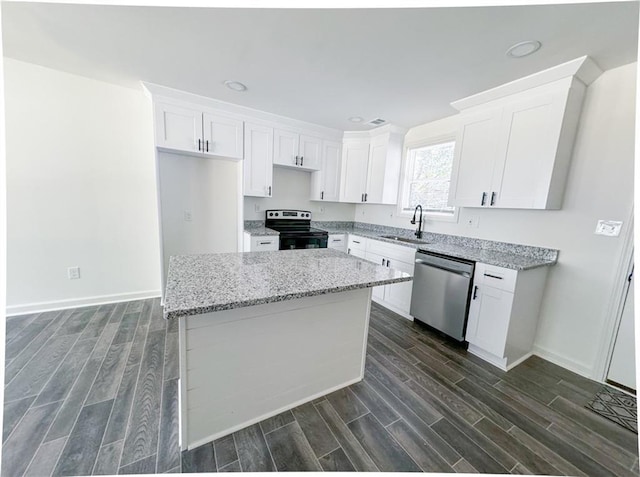 kitchen with sink, white cabinets, and appliances with stainless steel finishes