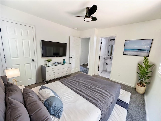 bedroom featuring carpet flooring, ceiling fan, and connected bathroom