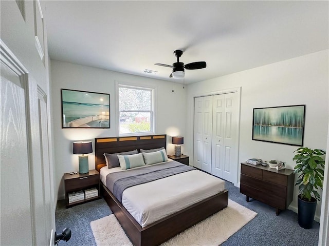 carpeted bedroom featuring ceiling fan and a closet