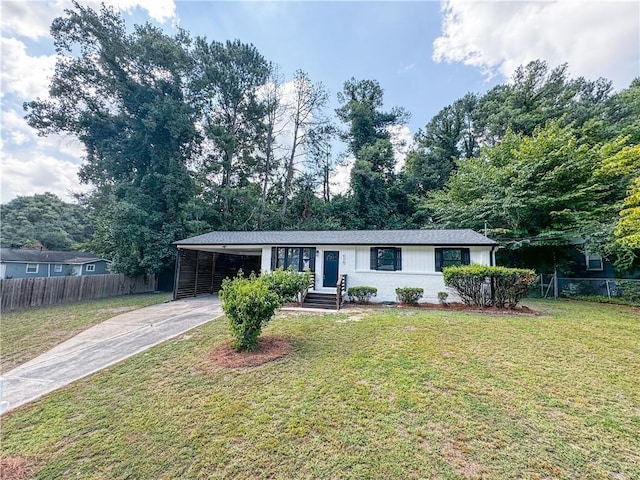 single story home with a front yard and a carport