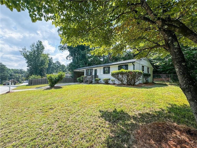 ranch-style house with a front lawn