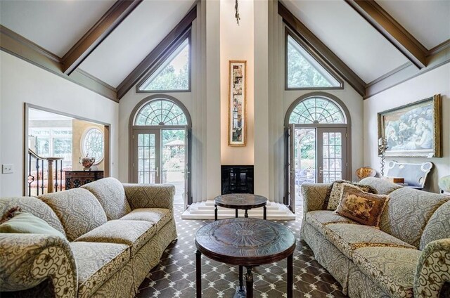 5318 Brooke Farm Dr, Dunwoody, GA 30338 - living room featuring high vaulted ceiling, beamed ceiling, plenty of natural light, and french doors