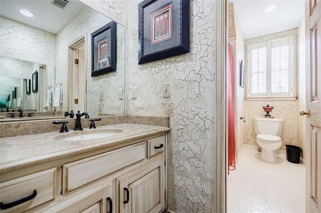 5318 Brooke Farm Dr, Dunwoody, GA 30338 - full bathroom with vanity, toilet, and tile patterned floors