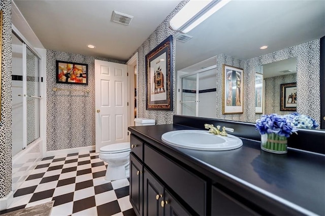 5318 Brooke Farm Dr, Dunwoody, GA 30338 - full bath with tile patterned floors, toilet, vanity, wallpapered walls, and recessed lighting
