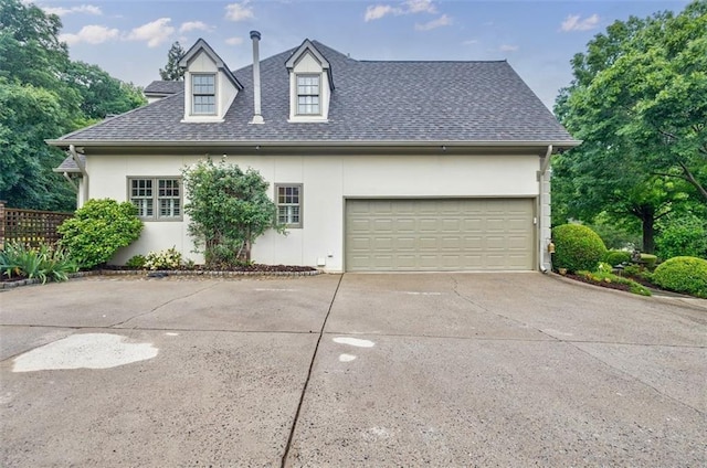 5318 Brooke Farm Dr, Dunwoody, GA 30338 - view of side of home featuring stucco siding, concrete driveway, roof with shingles, and an attached garage
