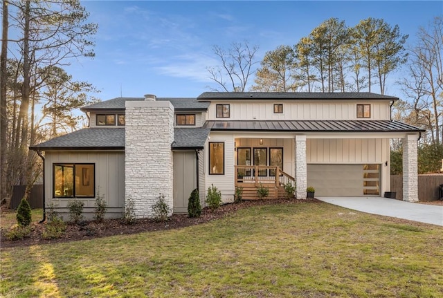 view of front of home with a garage, a porch, and a front lawn