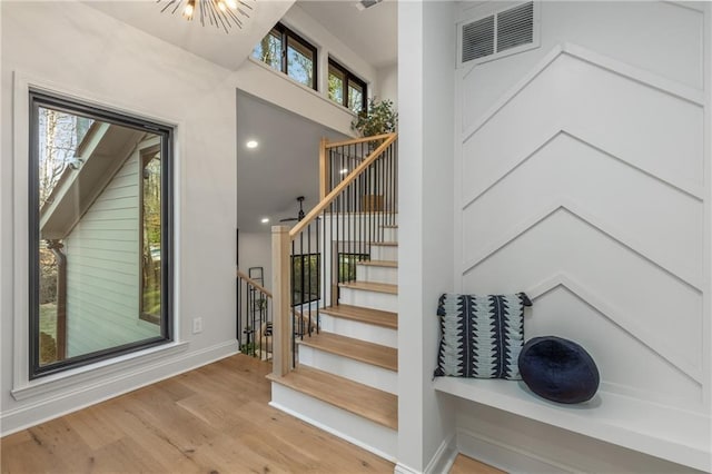 stairway featuring wood-type flooring