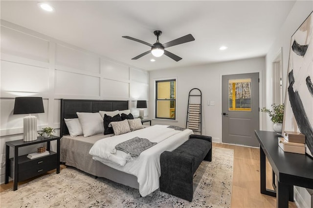 bedroom featuring ceiling fan and light hardwood / wood-style floors