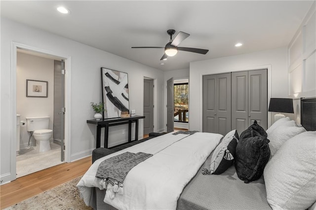 bedroom featuring connected bathroom, a closet, ceiling fan, and light wood-type flooring