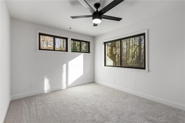 spare room with ceiling fan and carpet floors