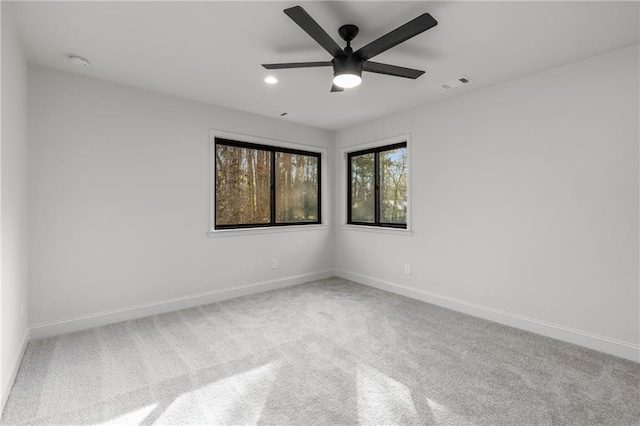 empty room with carpet floors and ceiling fan