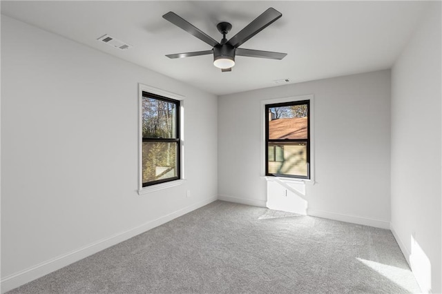 carpeted empty room with ceiling fan