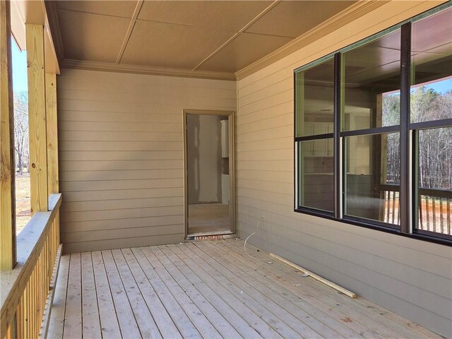 empty room featuring a chandelier and light hardwood / wood-style floors