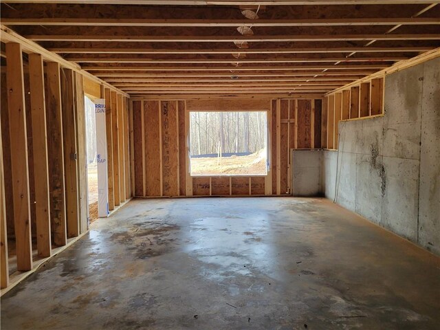 spare room featuring crown molding, a raised ceiling, and light wood-type flooring