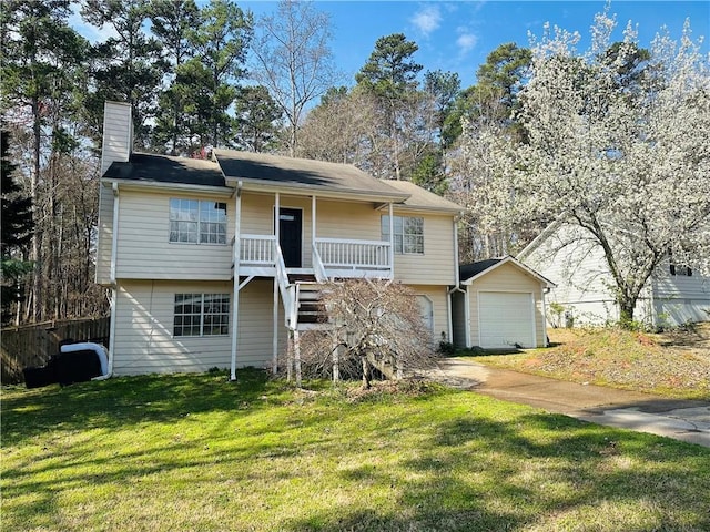 view of front of home featuring stairway, driveway, a porch, a front lawn, and a garage