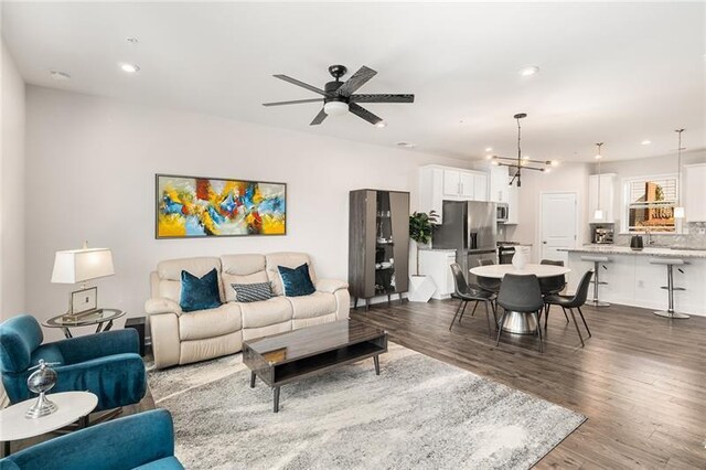 1590 Ridgebrook Downs, Mableton, GA 30126 - living room with wood finished floors, a ceiling fan, recessed lighting, and a chandelier
