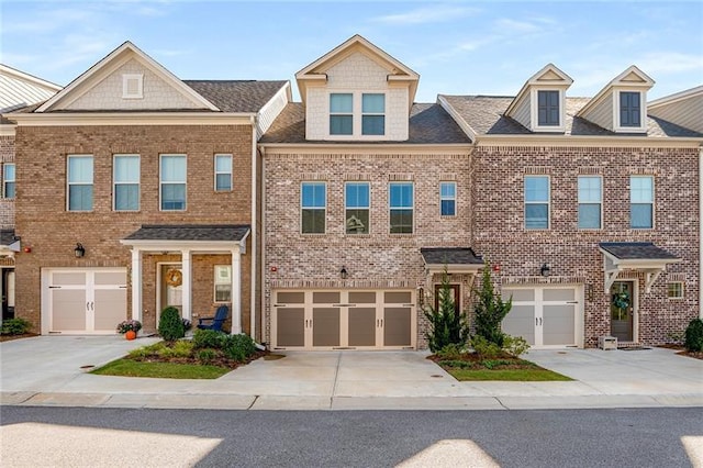 1590 Ridgebrook Downs, Mableton, GA 30126 - view of property with brick siding, driveway, and a garage