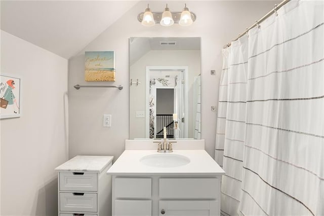 1590 Ridgebrook Downs, Mableton, GA 30126 - bathroom featuring vanity, lofted ceiling, and curtained shower