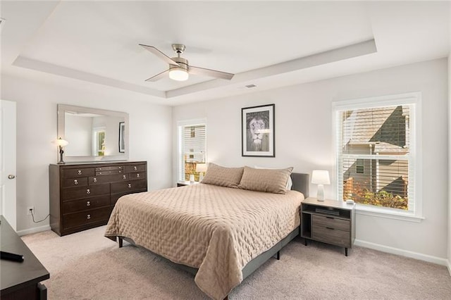 1590 Ridgebrook Downs, Mableton, GA 30126 - bedroom featuring a tray ceiling, light colored carpet, multiple windows, and baseboards