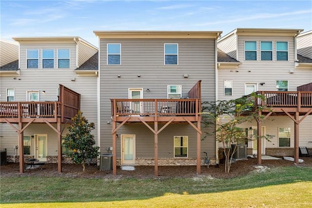 1590 Ridgebrook Downs, Mableton, GA 30126 - rear view of property with a lawn, central AC unit, roof with shingles, and a wooden deck