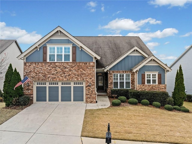 craftsman-style home featuring a front lawn and a garage