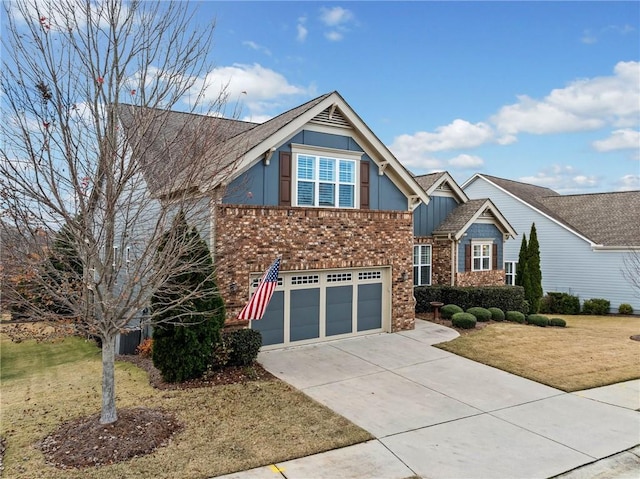 view of front of property with a front yard and a garage