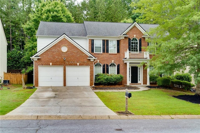 118 Brendylynn Trce, Woodstock, GA 30188 - colonial inspired home featuring concrete driveway, a balcony, an attached garage, and brick siding