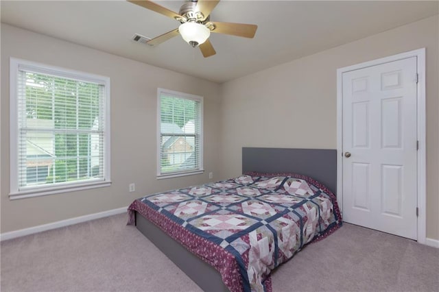 118 Brendylynn Trce, Woodstock, GA 30188 - carpeted bedroom featuring multiple windows, baseboards, and a ceiling fan