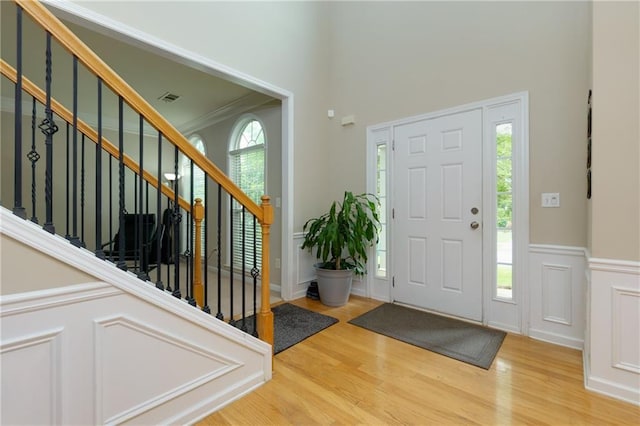 118 Brendylynn Trce, Woodstock, GA 30188 - entrance foyer with wood finished floors, stairway, a towering ceiling, and ornamental molding